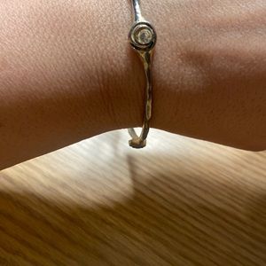 Lia Sophia| Lia Sophia silvertone and rhinestone ball/swirl hammered bangle